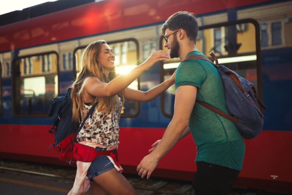 Beautiful couple hugging after long journey