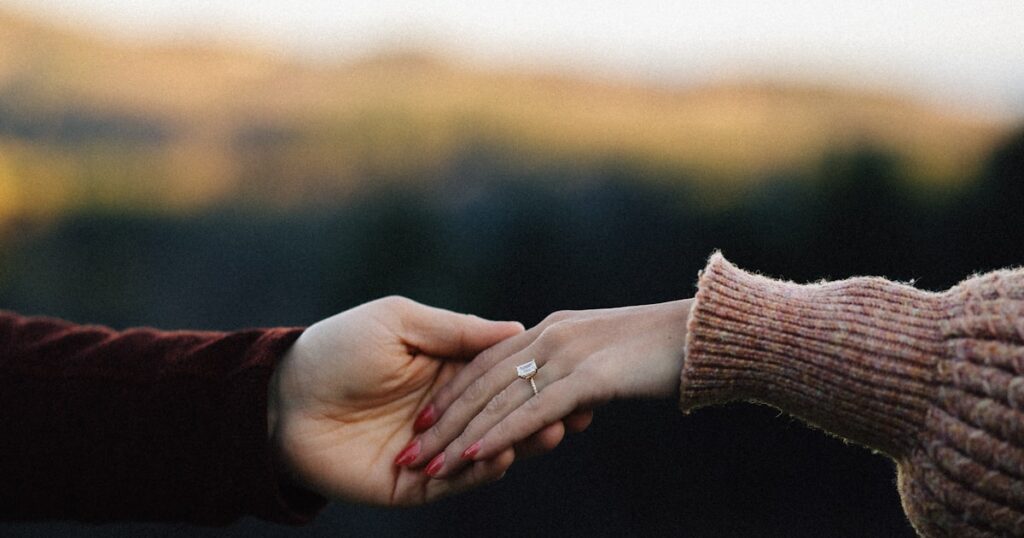 Questions to Ask Before Getting Engaged: The Conversations Couples Skip 1 A couple showing an engagement ring, on questions to ask before getting engaged