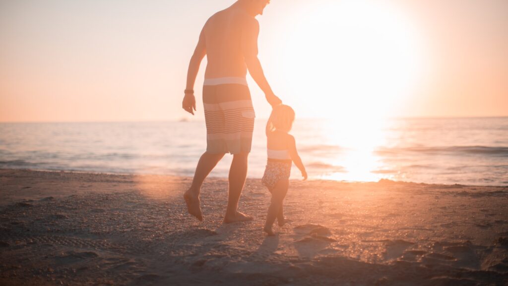 Co-Parenting After Divorce: What the Handoff Actually Requires 1 A parent and child walking together after a calm handoff