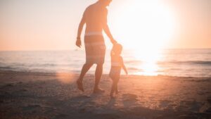 A parent and child walking together after a calm handoff
