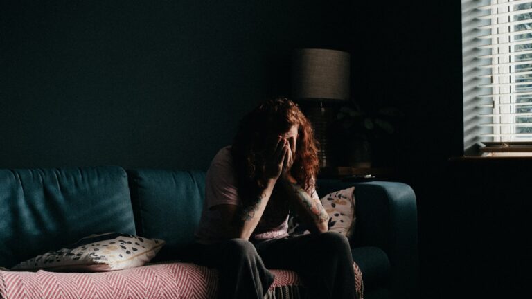 Home 68 A woman sitting alone, carrying the household mental load