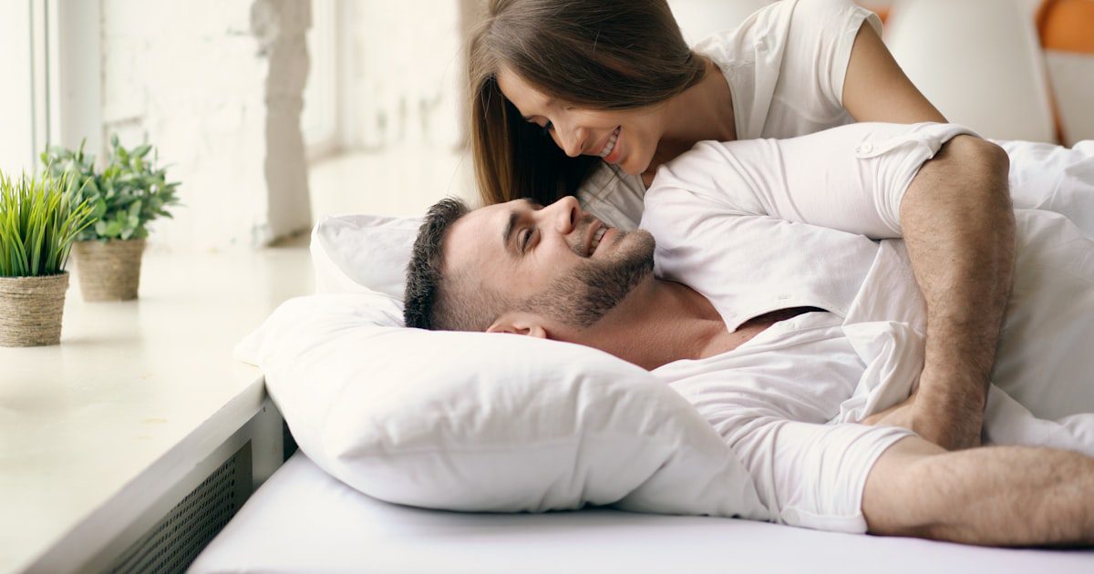 A couple waking together in bed, on mismatched libidos in a relationship