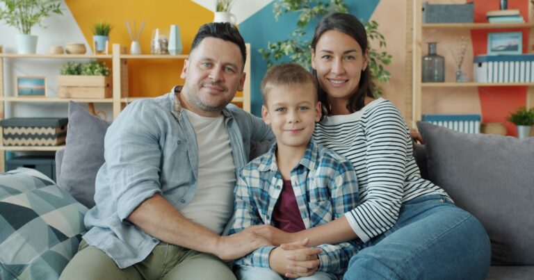 Home 65 Parents and child on a couch, illustrating parenting as a team
