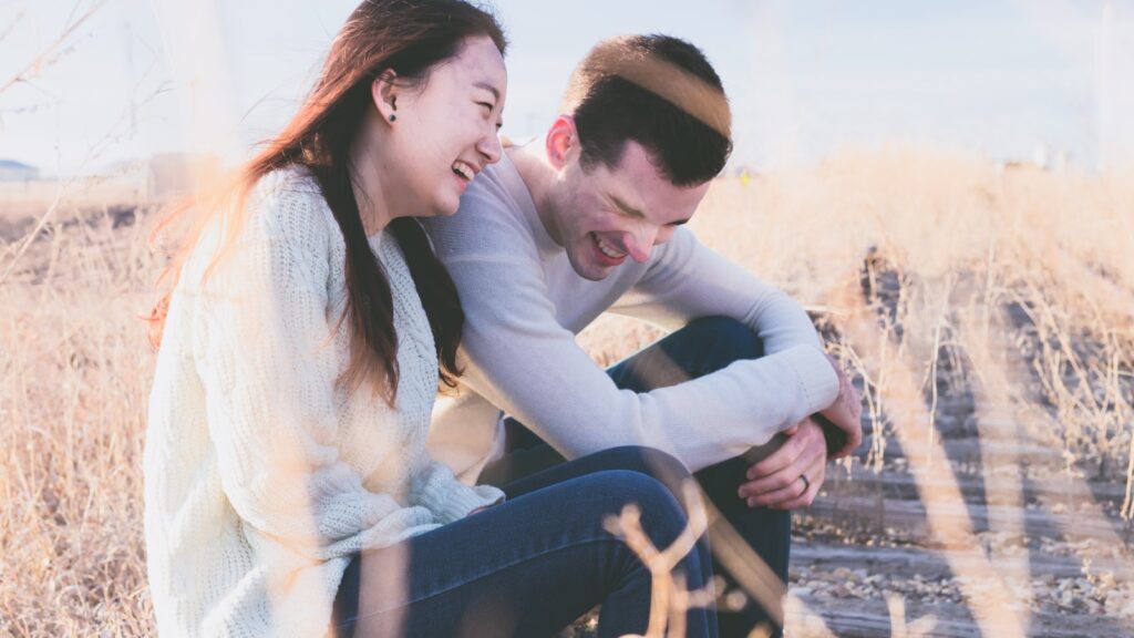 Re-Meeting Your Partner: How to Rekindle a Long-Term Relationship 4 A couple laughing together, re-meeting each other